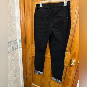 Maurice’s skinny black jeans with white and black cuff.  Size medium